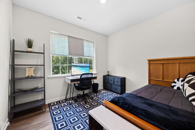 4157 Trevino Dr, Durham, NC 27704 - bedroom with baseboards and wood finished floors