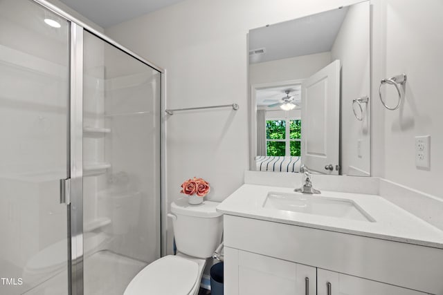 4157 Trevino Dr, Durham, NC 27704 - bathroom featuring a shower stall, a ceiling fan, toilet, and vanity