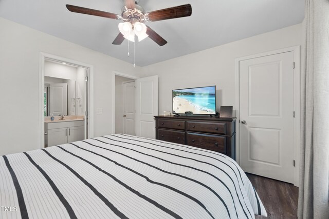 4157 Trevino Dr, Durham, NC 27704 - bedroom featuring dark wood-type flooring, a sink, a ceiling fan, and connected bathroom
