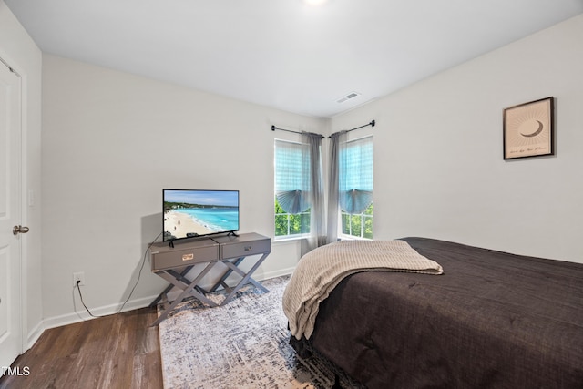 4157 Trevino Dr, Durham, NC 27704 - bedroom featuring wood finished floors and baseboards