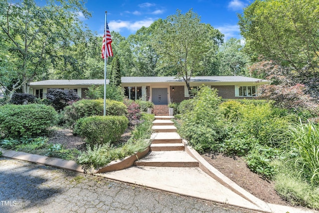 10909 Raven Rock Dr, Raleigh, NC 27614 - view of front of property featuring brick siding and stairway
