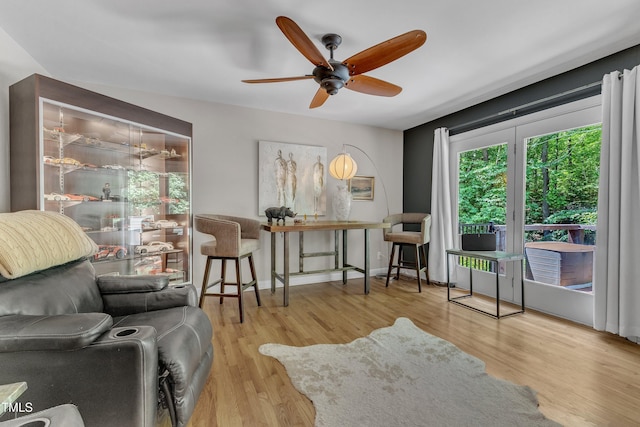 10909 Raven Rock Dr, Raleigh, NC 27614 - living room with ceiling fan, wood finished floors, and baseboards