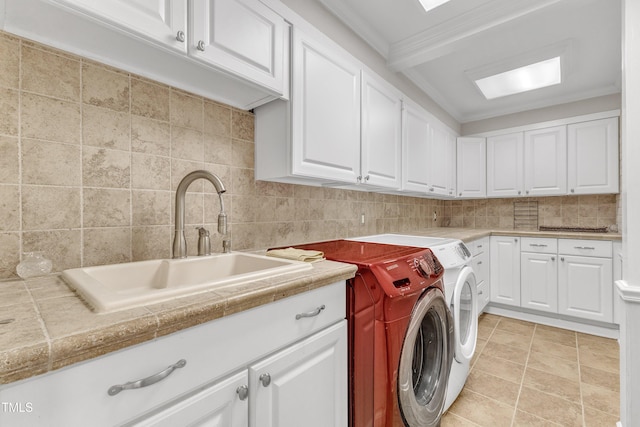 10909 Raven Rock Dr, Raleigh, NC 27614 - laundry room with independent washer and dryer, cabinet space, and crown molding