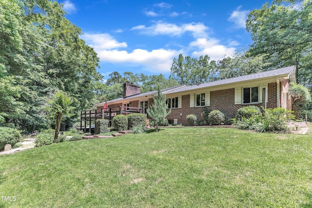 10909 Raven Rock Dr, Raleigh, NC 27614 - single story home with a chimney, a front yard, and brick siding