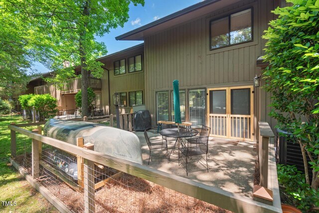 back of property featuring a patio