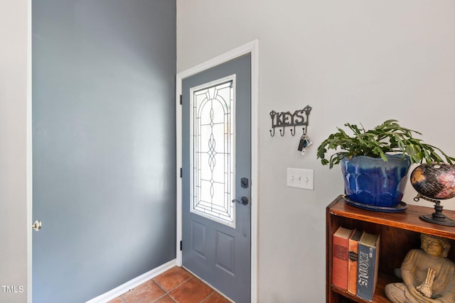 687 W Watson Rd, Benson, NC 27504 - entryway with baseboards and dark tile patterned flooring