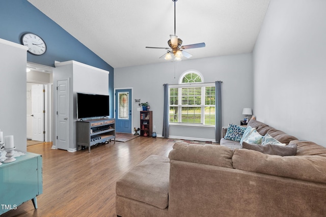 687 W Watson Rd, Benson, NC 27504 - living room with wood finished floors, a ceiling fan, and lofted ceiling