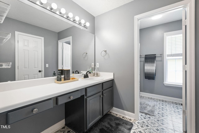 687 W Watson Rd, Benson, NC 27504 - bathroom featuring vanity, tile patterned floors, and baseboards