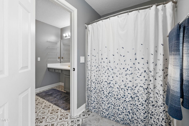 687 W Watson Rd, Benson, NC 27504 - bathroom with a textured ceiling, tile patterned floors, baseboards, and curtained shower