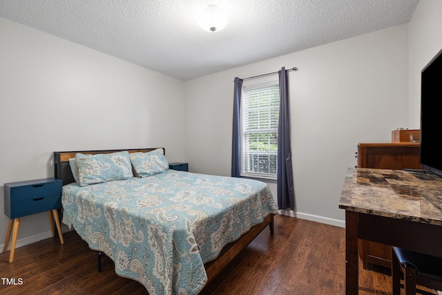 687 W Watson Rd, Benson, NC 27504 - bedroom featuring wood finished floors, baseboards, and a textured ceiling