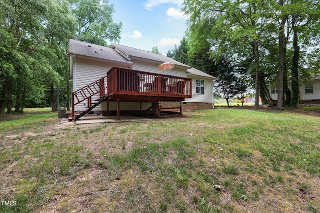 687 W Watson Rd, Benson, NC 27504 - back of house with stairs, a wooden deck, a yard, and central AC unit