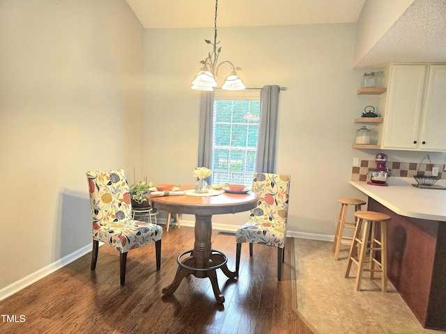 687 W Watson Rd, Benson, NC 27504 - dining area with baseboards and light wood-style floors