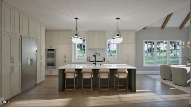 913 Tyrrell Rd, Raleigh, NC 27609 - kitchen featuring a sink, appliances with stainless steel finishes, light wood-type flooring, and light countertops