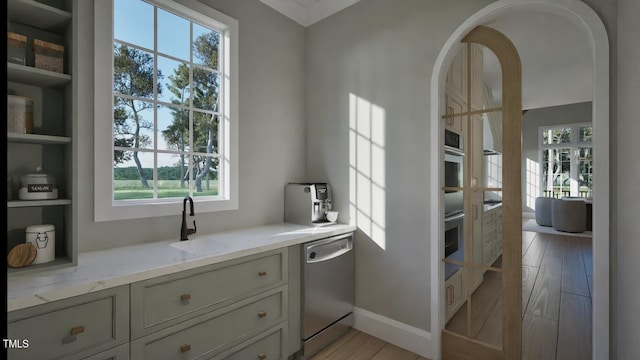 913 Tyrrell Rd, Raleigh, NC 27609 - kitchen featuring stainless steel dishwasher, healthy amount of natural light, and light stone counters