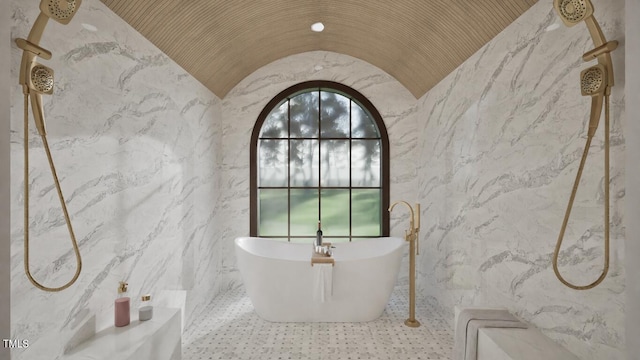 913 Tyrrell Rd, Raleigh, NC 27609 - bathroom with a marble finish shower, a freestanding bath, and stone wall