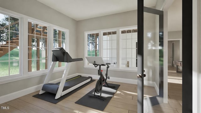 913 Tyrrell Rd, Raleigh, NC 27609 - workout area with french doors, baseboards, and wood finished floors