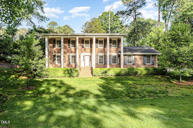 neoclassical / greek revival house with brick siding