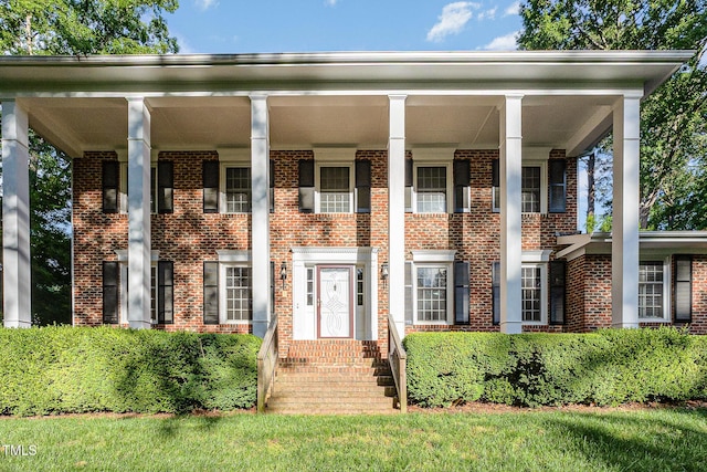 neoclassical / greek revival house with brick siding