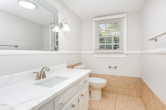 bathroom featuring tile patterned floors, vanity, and toilet