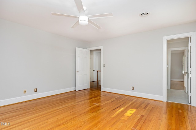 unfurnished bedroom featuring light wood-type flooring, baseboards, and a ceiling fan