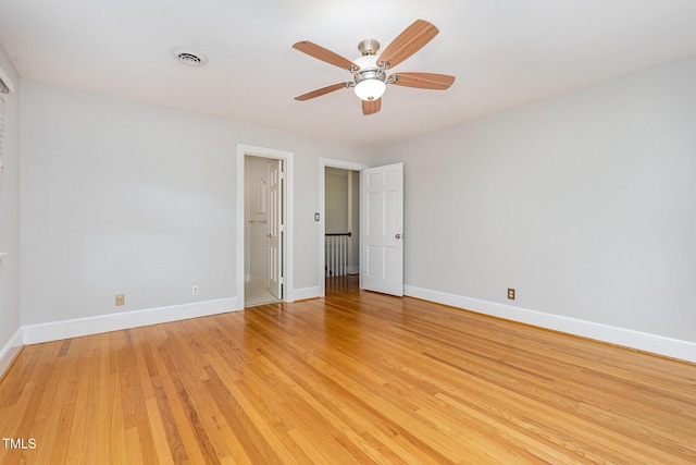 unfurnished bedroom featuring baseboards, light wood finished floors, and ceiling fan