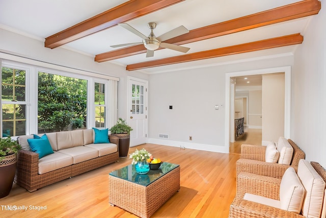 5513 Parkwood Dr, Raleigh, NC 27612 - living area featuring beam ceiling, a ceiling fan, light wood-style flooring, and crown molding
