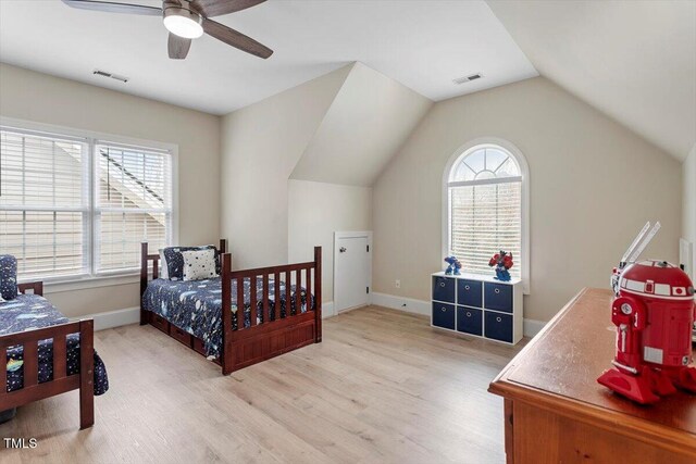 bedroom with wood finished floors, baseboards, vaulted ceiling, and ceiling fan