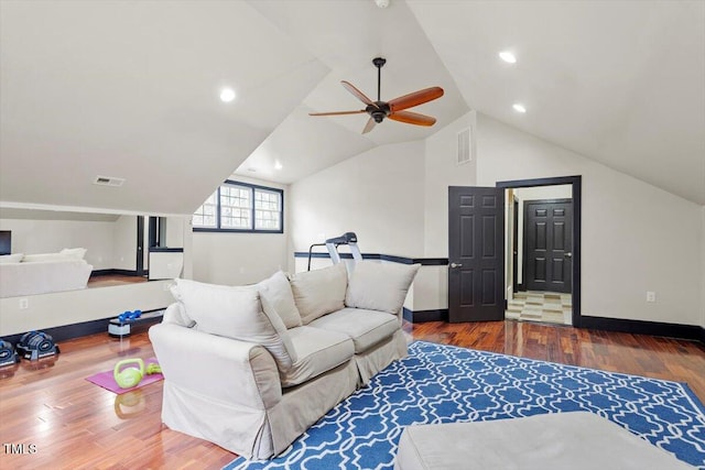 living room featuring wood finished floors, a ceiling fan, vaulted ceiling, baseboards, and recessed lighting