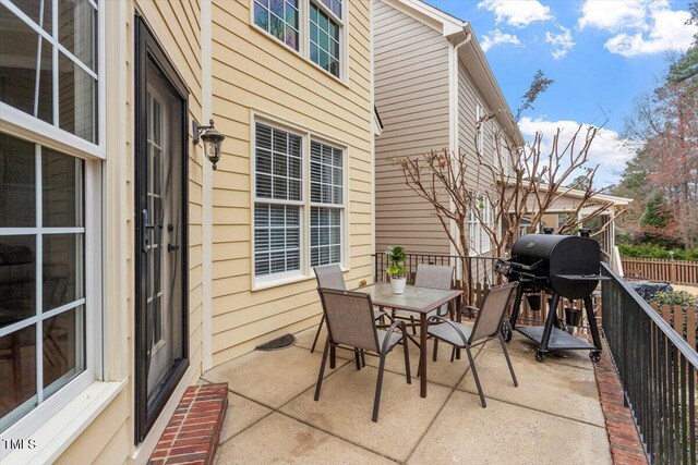 view of patio featuring outdoor dining area and grilling area