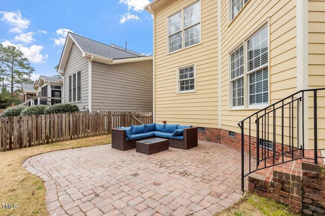 view of patio featuring outdoor lounge area and fence