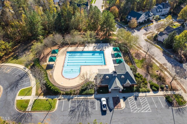 aerial view of property's location featuring a pool area