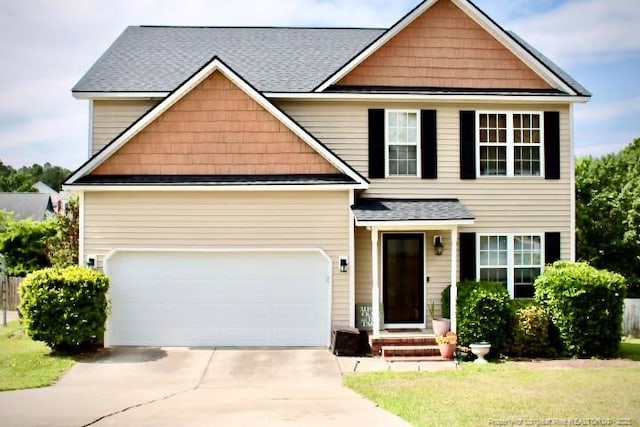 429 Bristlecone Rd, Fayetteville, NC 28311 - view of front facade featuring concrete driveway, a shingled roof, and a garage