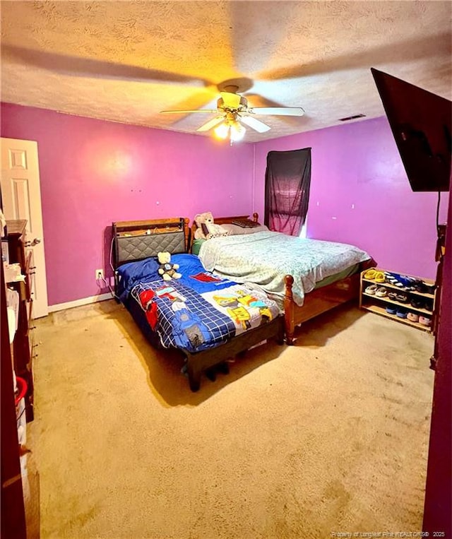 429 Bristlecone Rd, Fayetteville, NC 28311 - carpeted bedroom featuring a textured ceiling and a ceiling fan