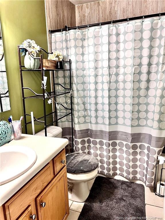 429 Bristlecone Rd, Fayetteville, NC 28311 - bathroom featuring tile patterned floors, toilet, a shower with curtain, and vanity