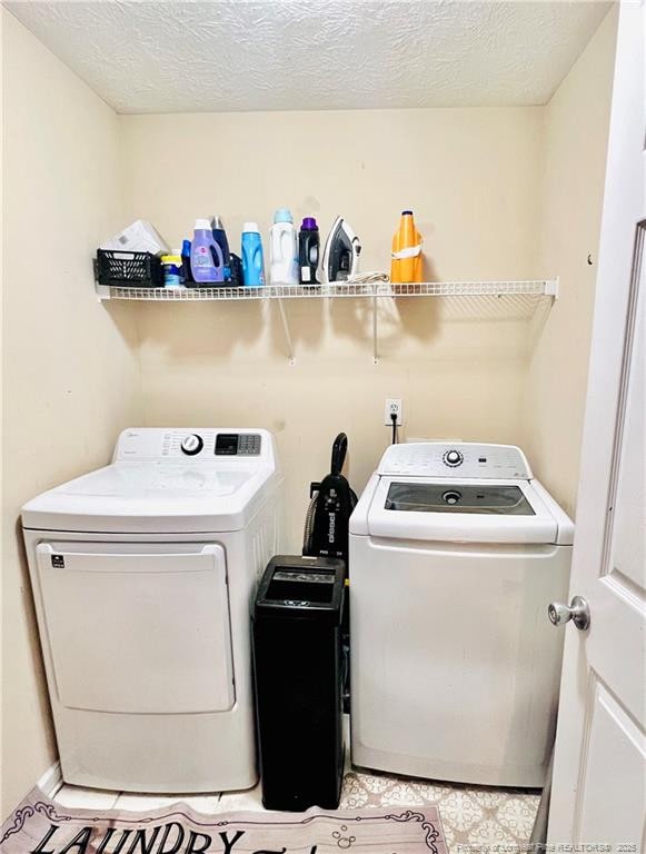 429 Bristlecone Rd, Fayetteville, NC 28311 - washroom featuring washer and clothes dryer and a textured ceiling