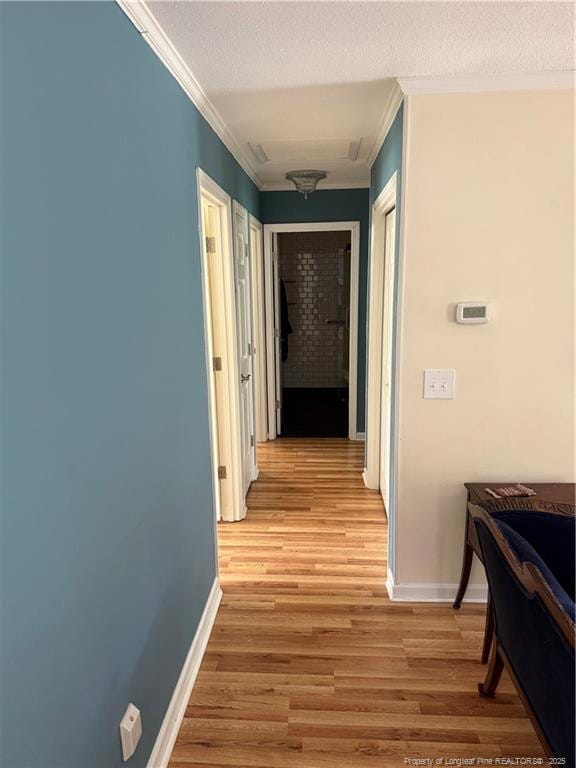 73 Night Heron Ct, Sanford, NC 27332 - hall with ornamental molding, light wood-style flooring, baseboards, and a textured ceiling
