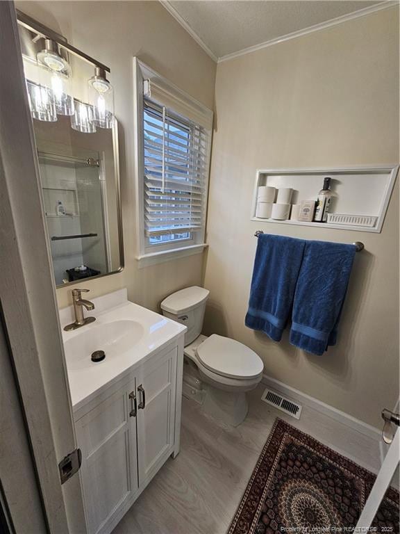 73 Night Heron Ct, Sanford, NC 27332 - full bathroom featuring a shower, crown molding, vanity, and toilet