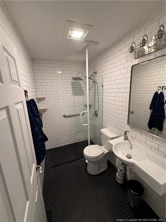 73 Night Heron Ct, Sanford, NC 27332 - full bathroom featuring tile walls, tiled shower, toilet, tile patterned flooring, and backsplash