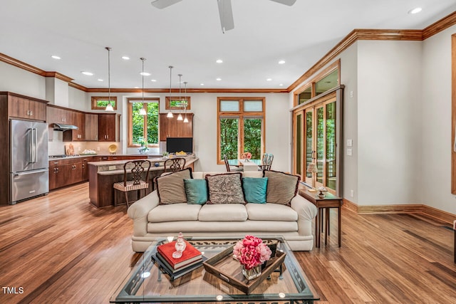 289 Stoneview, Pittsboro, NC 27312 - living area featuring ornamental molding, light wood-style floors, a ceiling fan, recessed lighting, and baseboards