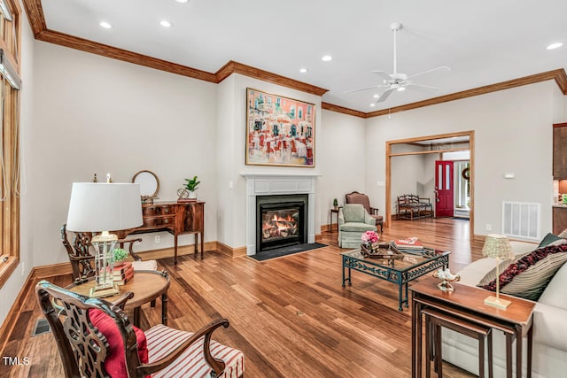 289 Stoneview, Pittsboro, NC 27312 - living room with a fireplace with flush hearth, recessed lighting, ornamental molding, wood finished floors, and ceiling fan