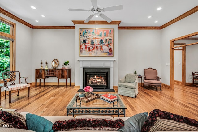 289 Stoneview, Pittsboro, NC 27312 - living area with ornamental molding, ceiling fan, recessed lighting, a fireplace with flush hearth, and wood finished floors