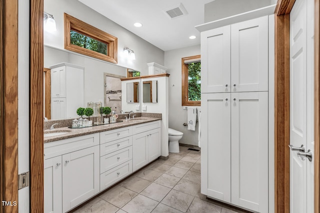 289 Stoneview, Pittsboro, NC 27312 - bathroom featuring double vanity, toilet, a closet, and recessed lighting