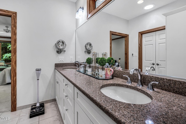 289 Stoneview, Pittsboro, NC 27312 - bathroom with double vanity, baseboards, tile patterned flooring, and ceiling fan