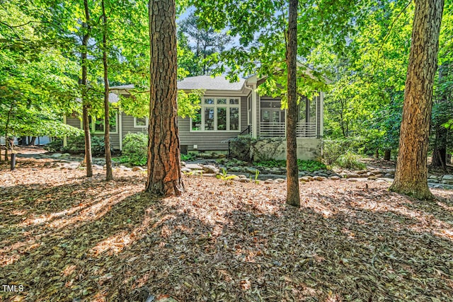 289 Stoneview, Pittsboro, NC 27312 - view of front of house with a sunroom and roof with shingles