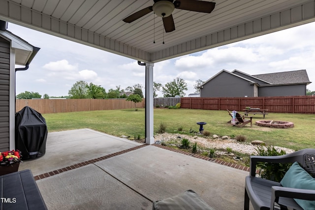 view of patio with a fire pit and ceiling fan