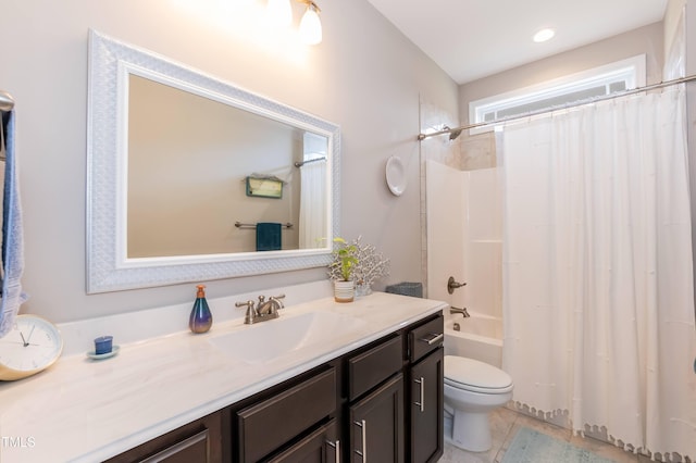 bathroom with toilet, vanity, and shower / bathtub combination with curtain