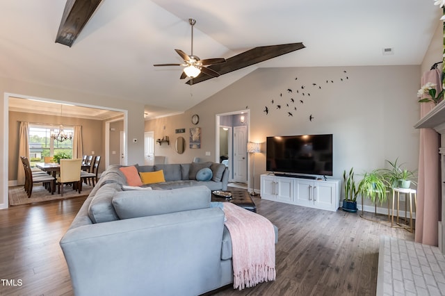 living room featuring a chandelier, wood finished floors, lofted ceiling, ceiling fan, and baseboards