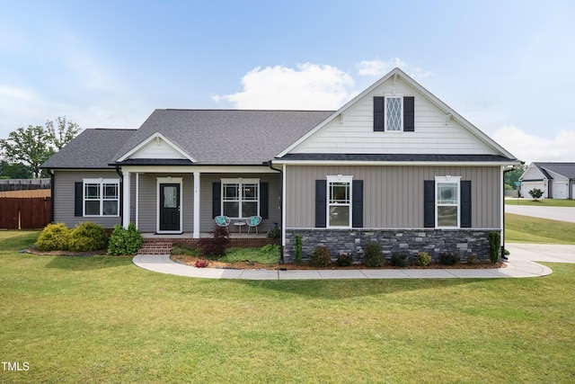 view of front of house featuring a shingled roof and a porch