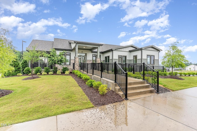646 Shelford Trl, Zebulon, NC 27597 - contemporary house with a front yard and roof with shingles