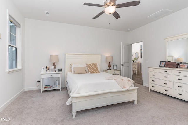 646 Shelford Trl, Zebulon, NC 27597 - bedroom with light colored carpet, baseboards, and a ceiling fan